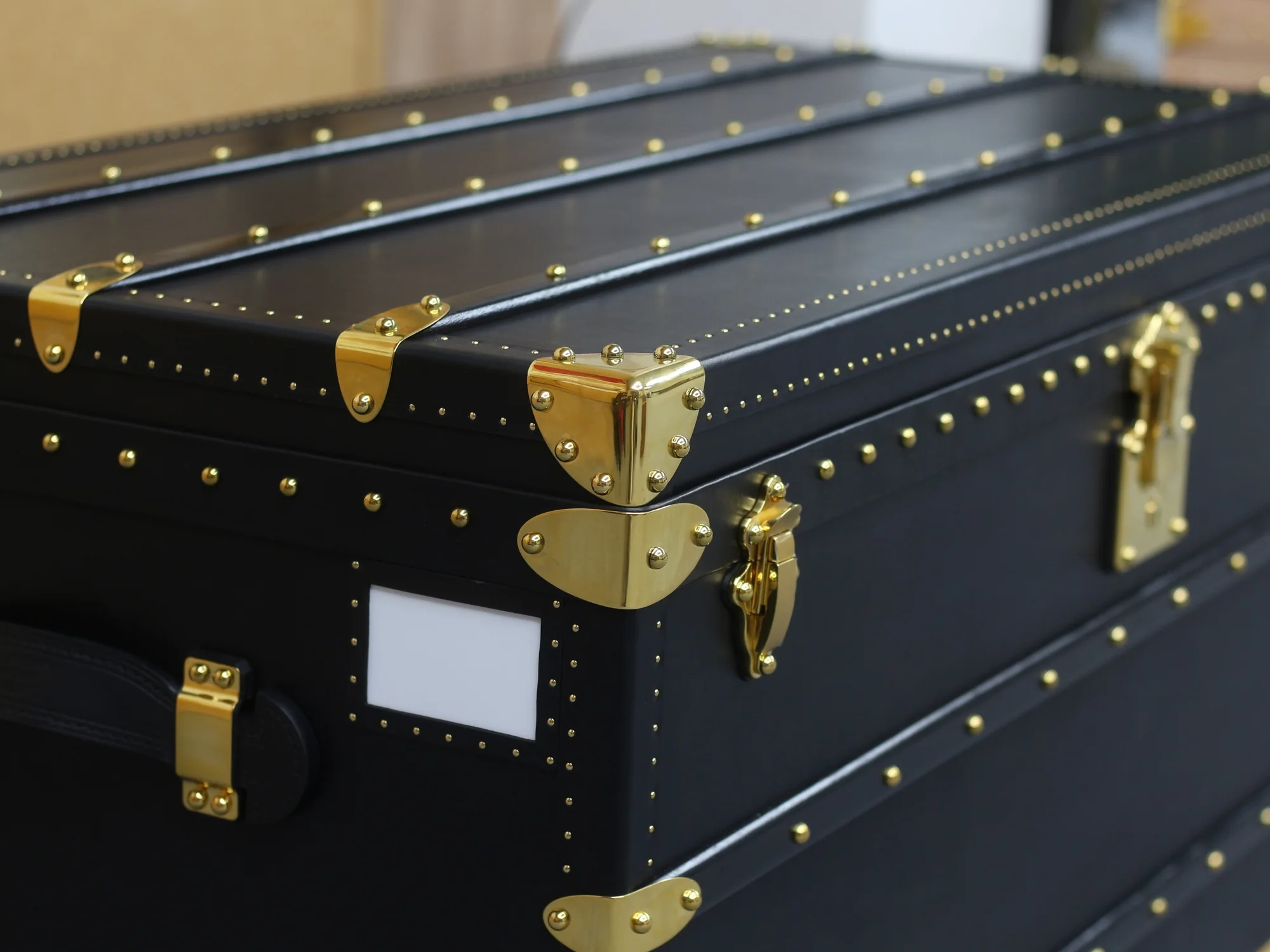 Black Collector's Trunk, gold-tone corner and latch detail