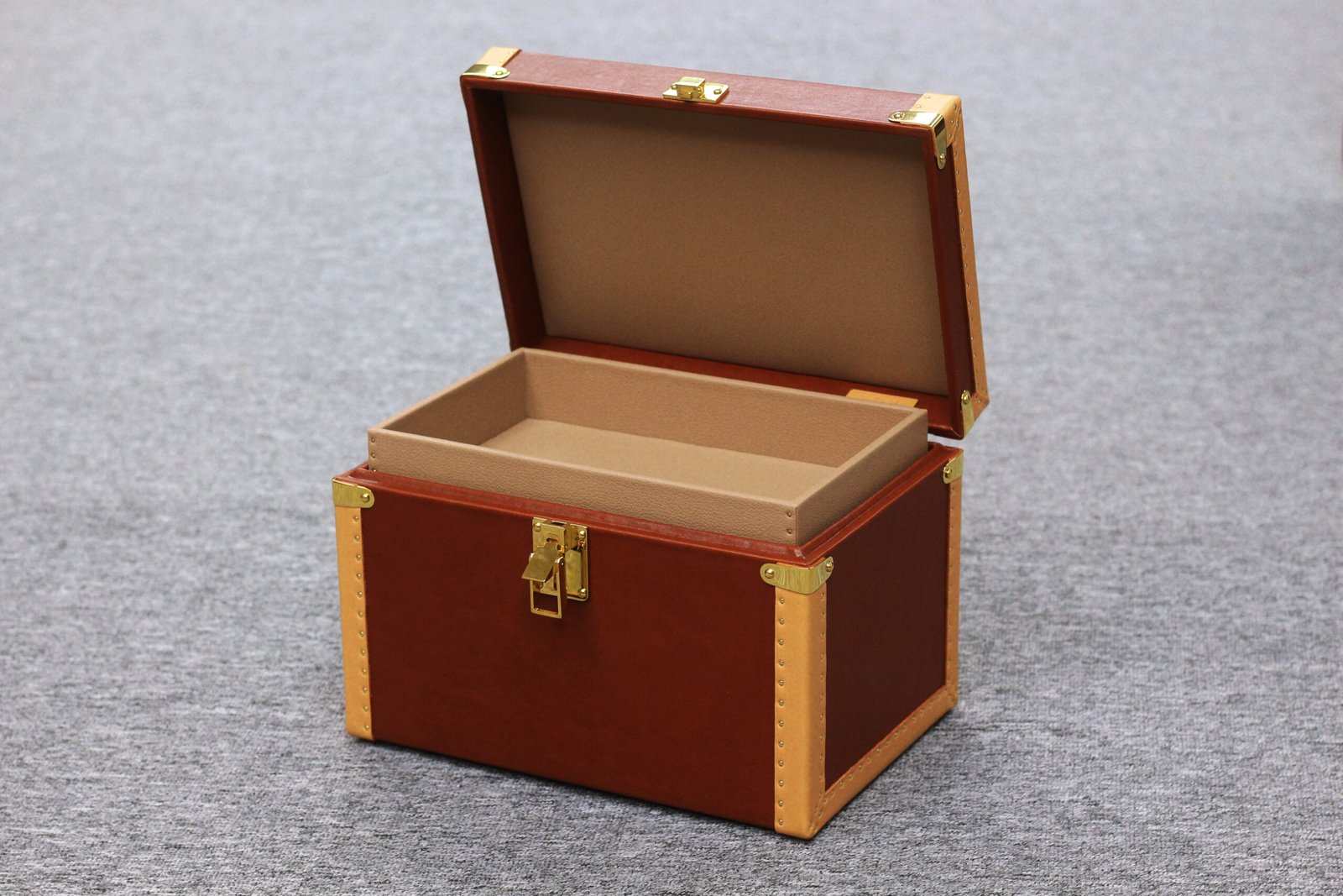 `Open leather storage case showing removable inner tray`
