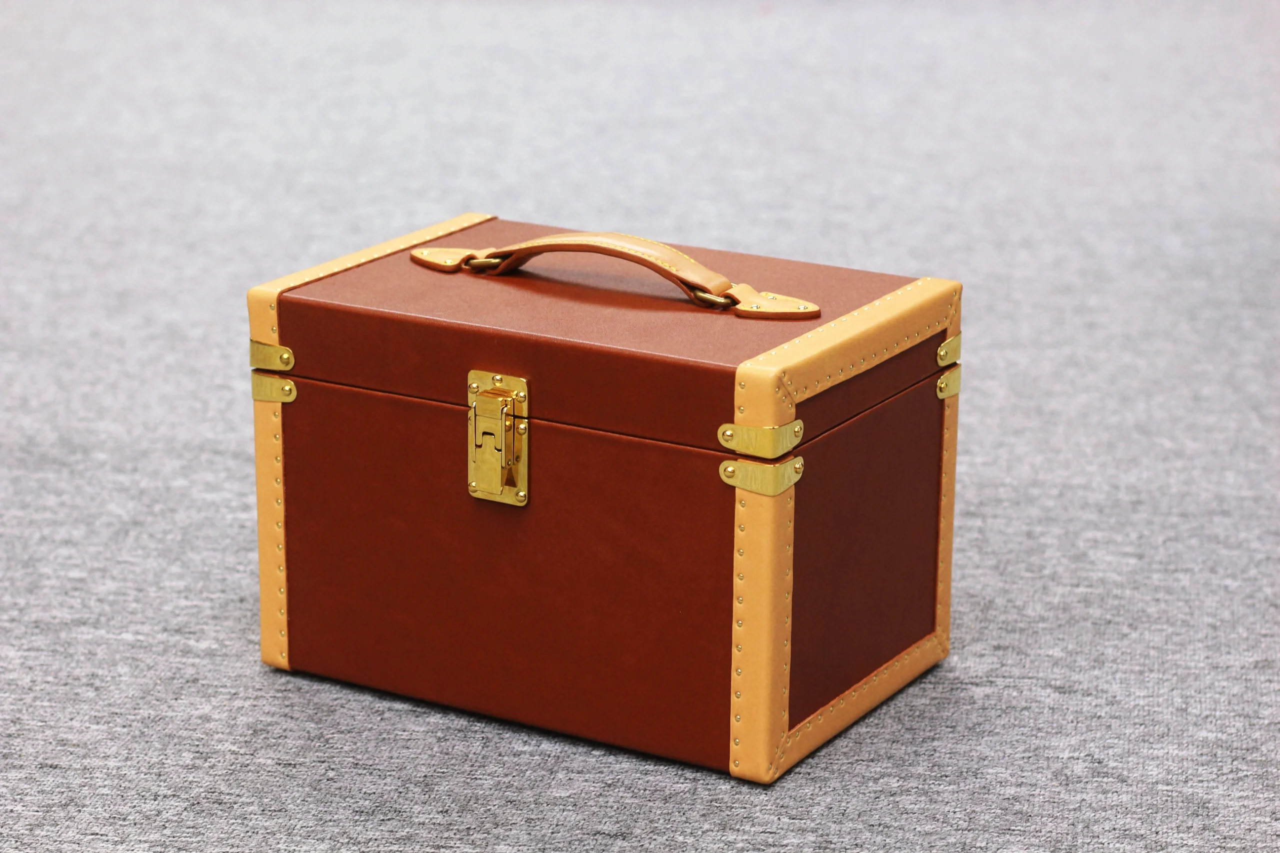 Brown full-grain leather storage case with brass lock